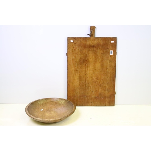 152 - Late 19th Century / early 20th Century wooden chopping / serving board together with an antique soli... 