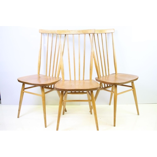 549 - Set of four Ercol blonde elm and beech stickback chairs, model 608, two with partial maker's labels,... 