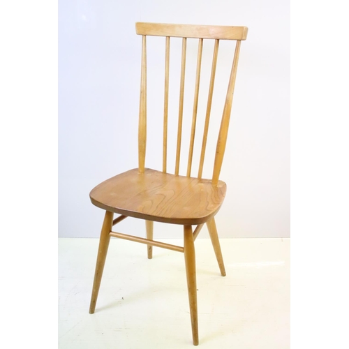 549 - Set of four Ercol blonde elm and beech stickback chairs, model 608, two with partial maker's labels,... 