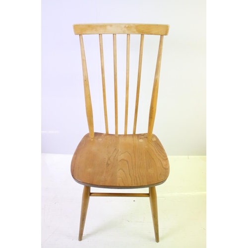 549 - Set of four Ercol blonde elm and beech stickback chairs, model 608, two with partial maker's labels,... 