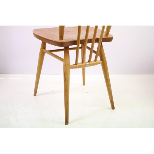 549 - Set of four Ercol blonde elm and beech stickback chairs, model 608, two with partial maker's labels,... 