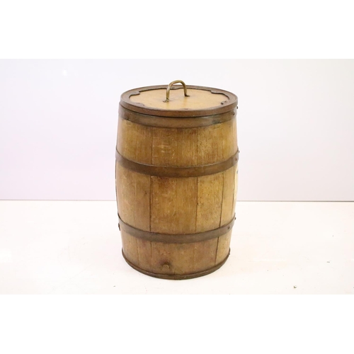 551 - Victorian oak and iron bound barrel with lidded top, 57.5cm high, 38cm diameter (top)