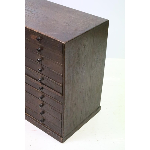 557 - Collectors cabinet, an arrangement of thirty drawers, 52cm high x 77cm wide x 32cm deep