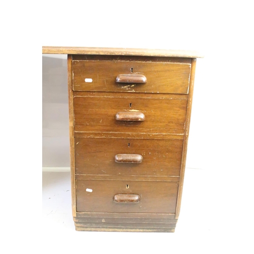 572 - Mid century mahogany twin pedestal desk with leather inset top, above an arrangement of eight drawer... 