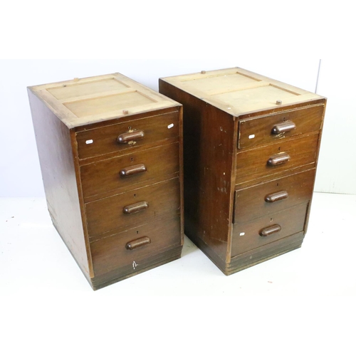 572 - Mid century mahogany twin pedestal desk with leather inset top, above an arrangement of eight drawer... 