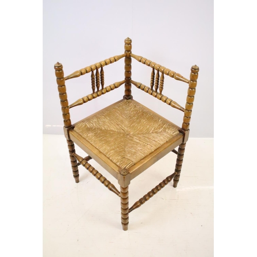 573 - Bobbin turned corner chair, with rush seat, 73.5cm high x 42cm wide x 42cm deep