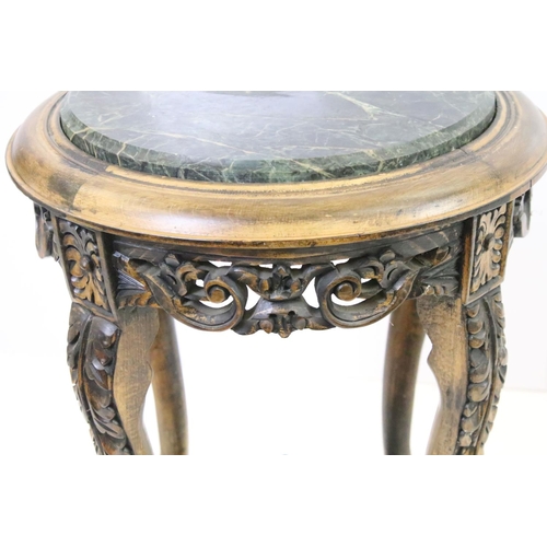 585A - Carved hardwood jardiniere stand with x-frame stretcher, with circular marble top, 53cm high x 39cm ... 