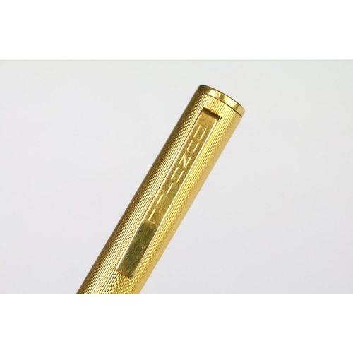 202A - A vintage Dunhill gold plated fountain pen with 14ct gold nib, Alfred Dunhill logo stamped to pin li... 