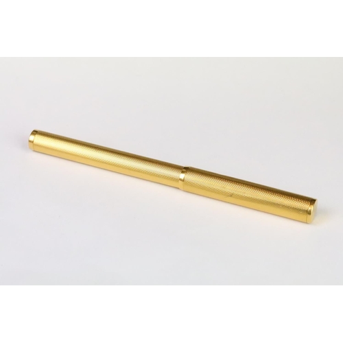 202A - A vintage Dunhill gold plated fountain pen with 14ct gold nib, Alfred Dunhill logo stamped to pin li... 