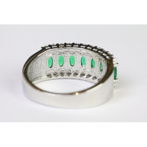 211A - A 925 sterling silver ladies dress ring in the Art Deco style set with green and clear stones, marke... 