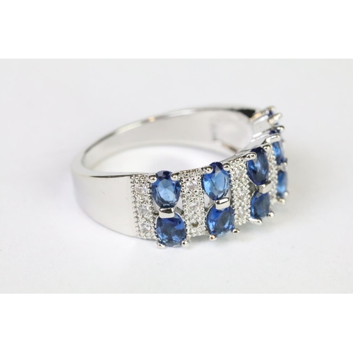 219A - A 925 sterling silver ladies dress ring in the Art Deco style set with blue and clear stones, marked... 