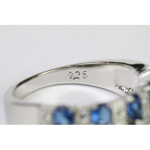 219A - A 925 sterling silver ladies dress ring in the Art Deco style set with blue and clear stones, marked... 