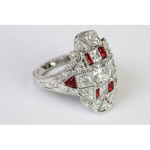 230A - A 925 sterling silver ladies dress ring in the Art Deco style set with red and clear stones, marked ... 