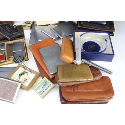 291 - A group of smoking related collectables to include cigarette cases, leather cigar cases, lighters, m... 