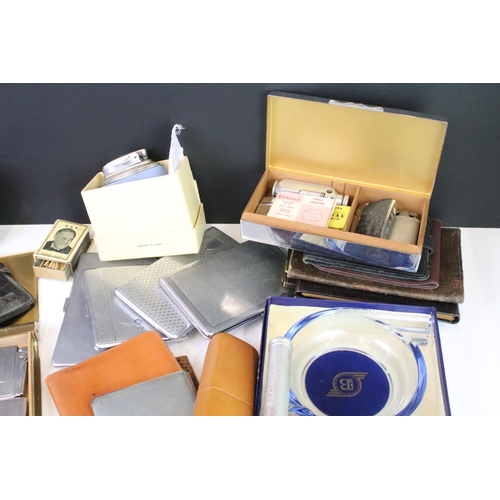 291 - A group of smoking related collectables to include cigarette cases, leather cigar cases, lighters, m... 