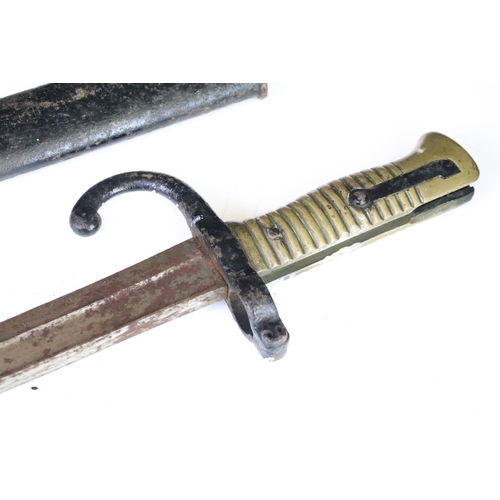 295 - A French World War One sword bayonet complete with scabbard.