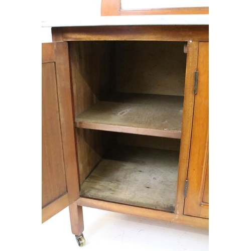 562 - Victorian mahogany washstand, with marble top and marble back above an arrangement of three cupboard... 