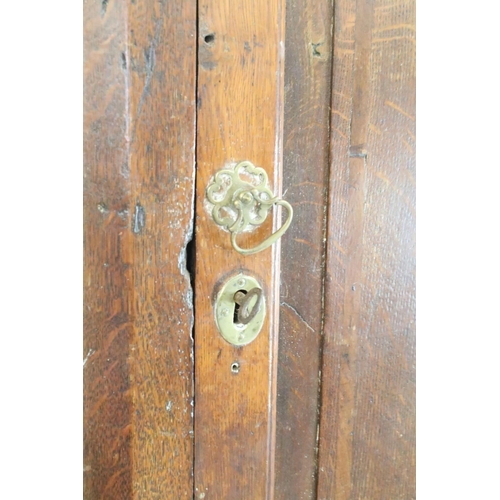 580 - Georgian oak corner cupboard, with dentil cornice above panelled door with parquetry geometric star ... 