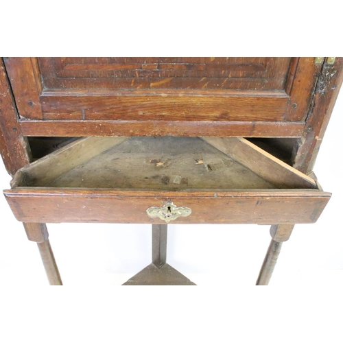 580 - Georgian oak corner cupboard, with dentil cornice above panelled door with parquetry geometric star ... 