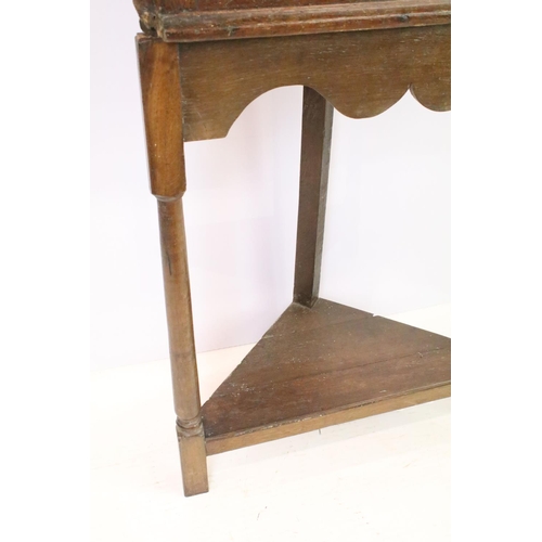 580 - Georgian oak corner cupboard, with dentil cornice above panelled door with parquetry geometric star ... 