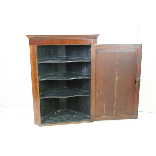 581 - 19th century oak corner cupboard, with double line inlay above panelled door, three fitted shelves t... 