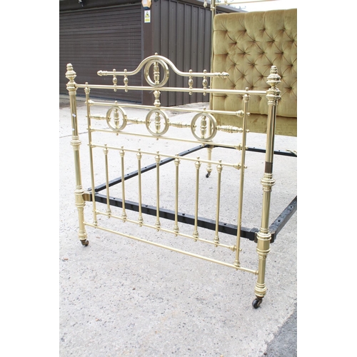 594 - Ornate brass bed frame, the headboard with swing frame side panels, 229cm high x 132cm wide with mus... 