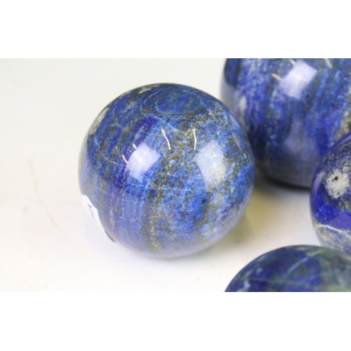 301 - A collection of six polished Lapis Lazuli balls.