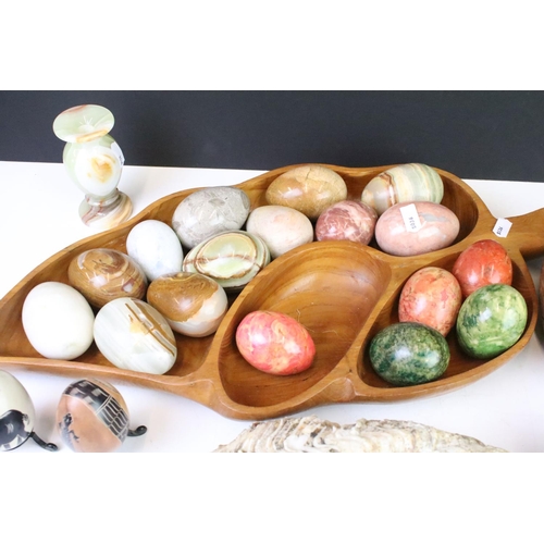 308 - A large collection of polished stone eggs together with fruit examples