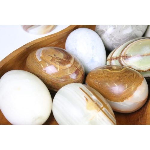 308 - A large collection of polished stone eggs together with fruit examples