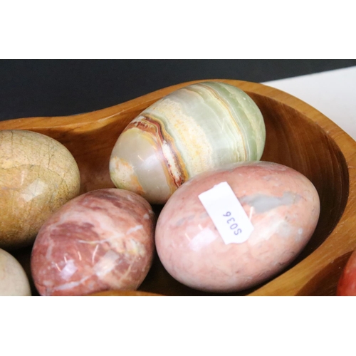 308 - A large collection of polished stone eggs together with fruit examples