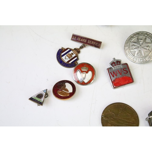 315 - A small group of mixed collectables to include sterling silver watch fobs, medals, badges, penknife ... 