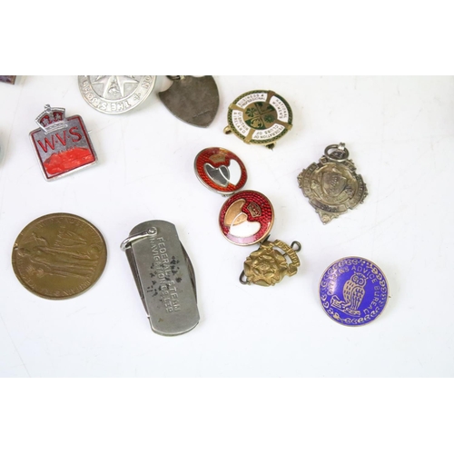 315 - A small group of mixed collectables to include sterling silver watch fobs, medals, badges, penknife ... 