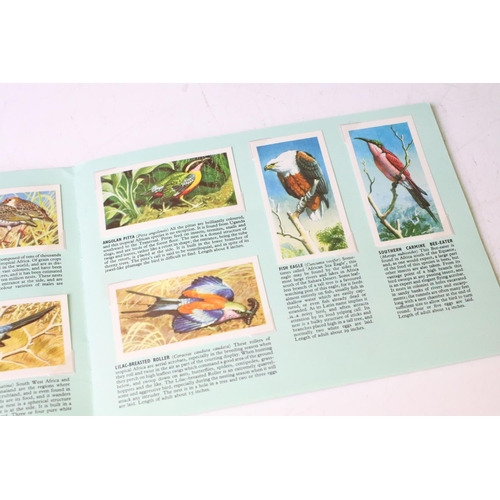 338 - Collection of tea cards to include Brooke Bond card in albums, four albums of cigarette cards and a ... 