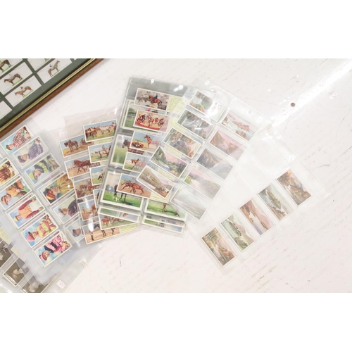 350 - A collection of cigarette cards to include loose and framed examples to include Players, Gallaher an... 