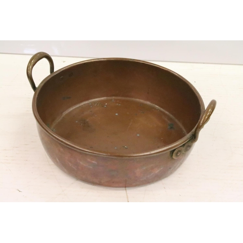 413 - Large copper shallow pan, with two brass handles, 12cm high (excluding handles), 41cm diameter (excl... 