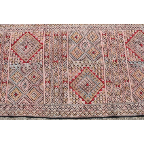 550A - Middle Eastern runner with all over geometric design, 304cm long x 83cm wide