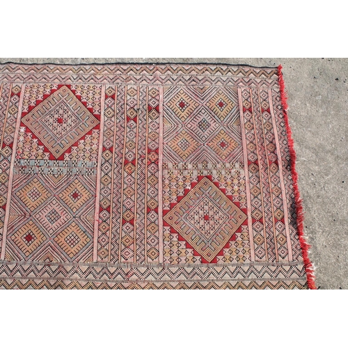 550A - Middle Eastern runner with all over geometric design, 304cm long x 83cm wide