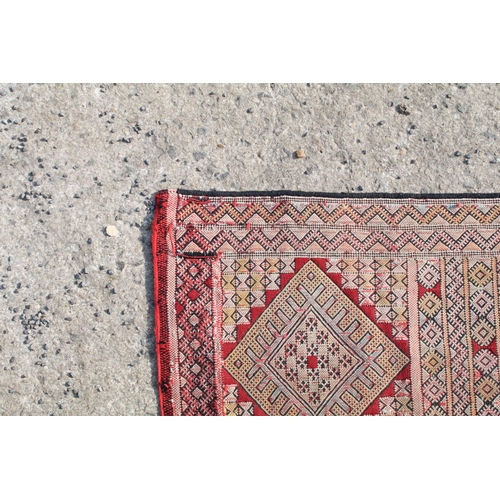 550A - Middle Eastern runner with all over geometric design, 304cm long x 83cm wide