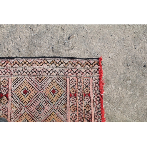 550A - Middle Eastern runner with all over geometric design, 304cm long x 83cm wide