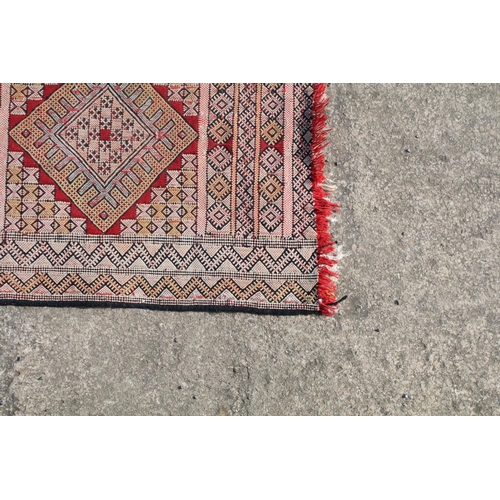 550A - Middle Eastern runner with all over geometric design, 304cm long x 83cm wide