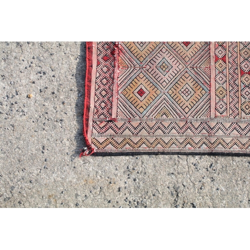 550A - Middle Eastern runner with all over geometric design, 304cm long x 83cm wide