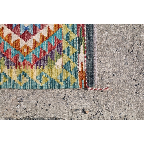 560A - Hand knotted woollen Chobi Kilim rug, 150cm long x 100cm wide