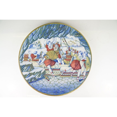28 - Two Italian faience wall plates, one depicting Roman figures with a volcano beyond, the other with a... 