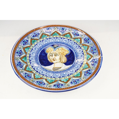 28 - Two Italian faience wall plates, one depicting Roman figures with a volcano beyond, the other with a... 