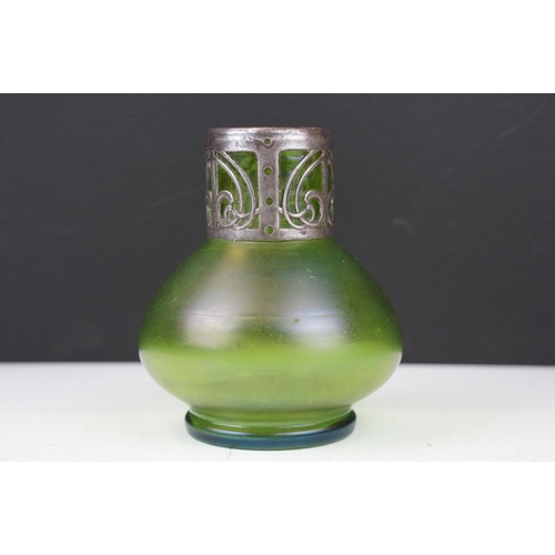 3 - Art Nouveau green iridescent glass vase, of squat baluster form, with pierced white metal mount to n... 