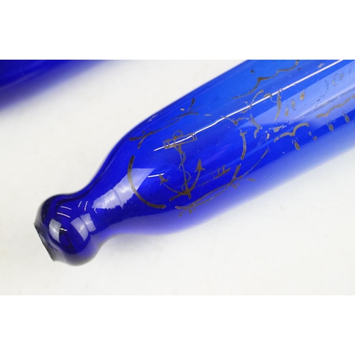 48 - Two 19th century Bristol blue glass rolling pins, one with sailing themed detail & inscription, long... 