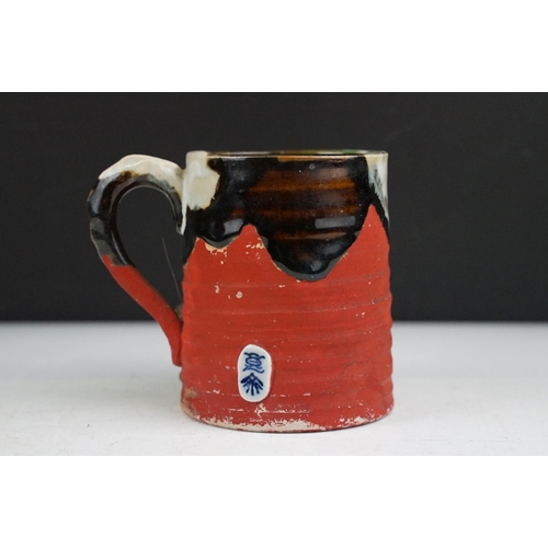 57 - Japanese Sumida Gawa pottery mug / tankard, with relief decoration of a figure, signed Ryosai, appro... 