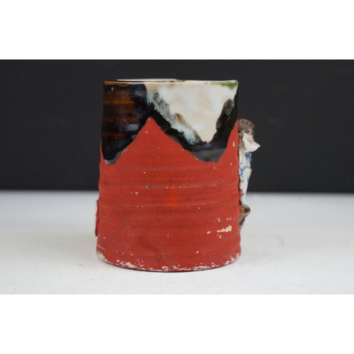 57 - Japanese Sumida Gawa pottery mug / tankard, with relief decoration of a figure, signed Ryosai, appro... 