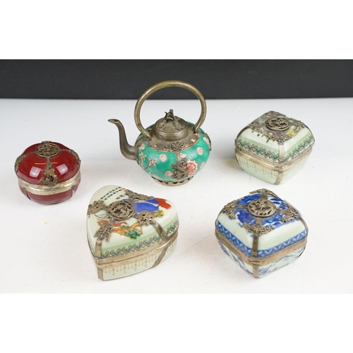 59 - Four Chinese porcelain trinket boxes with white metal mounts depicting dragons, birds & butterflies,... 