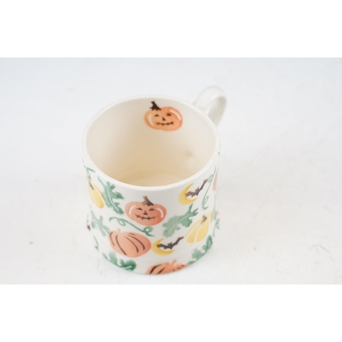 63 - A collection of three Emma Bridgewater Halloween pumpkin pattern items to include a 1/4 pint mug (Fi... 